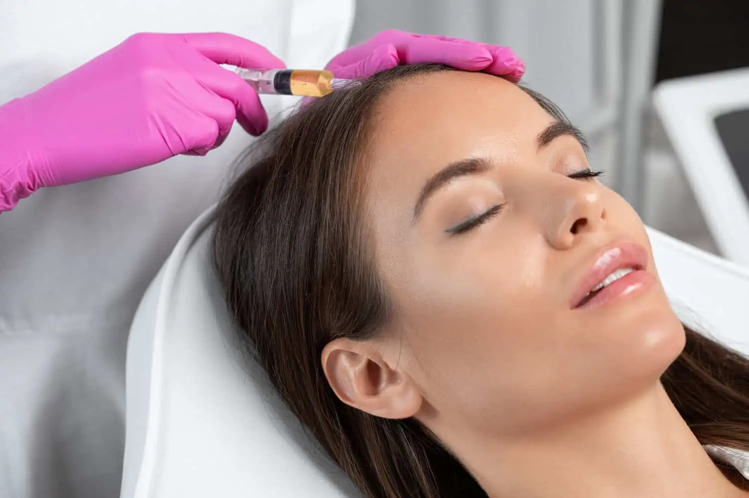 A woman lying down with her eyes closed receiving Platelet-Rich Plasma Treatment in Beverly Hills, CA | Maven Medispa
