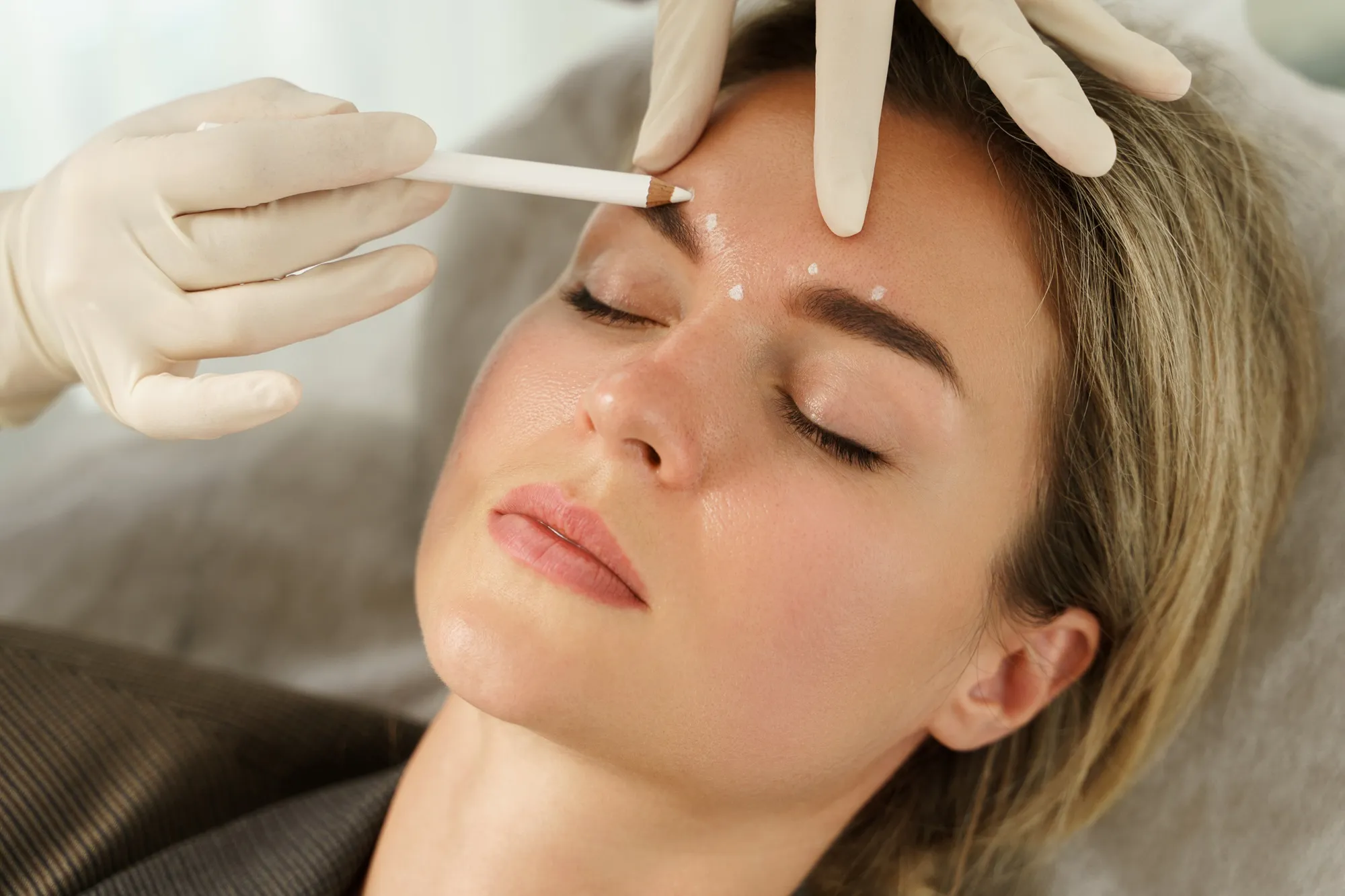 A Lying, closed eye Woman Getting Beauty in Beverly Hills, CA | Maven Medispa